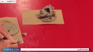 ساختن مجسمه قورباغه با زبان بزرگ